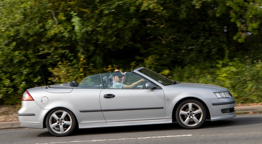 Man Driving Saab Car